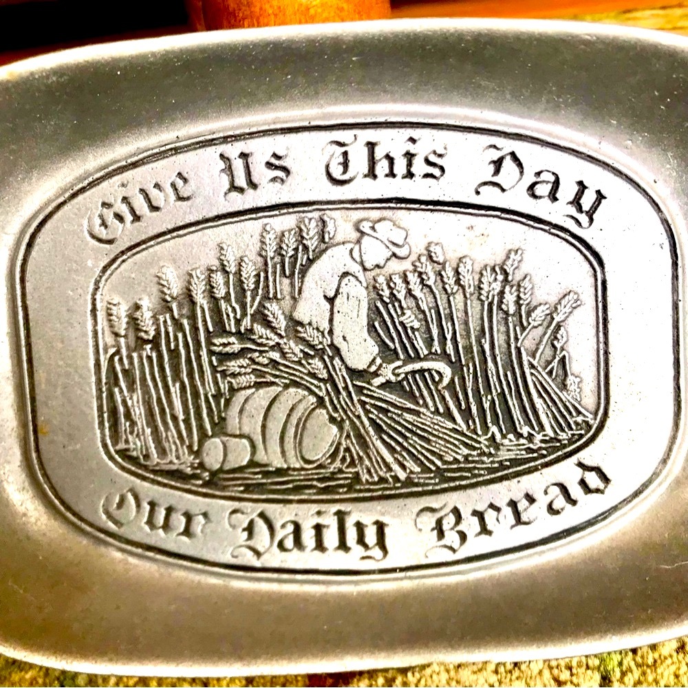 “Give Us This Day Our Daily Bread” pewter platter. Approx 9 1/4”x6 1/2”x1 3/8”
